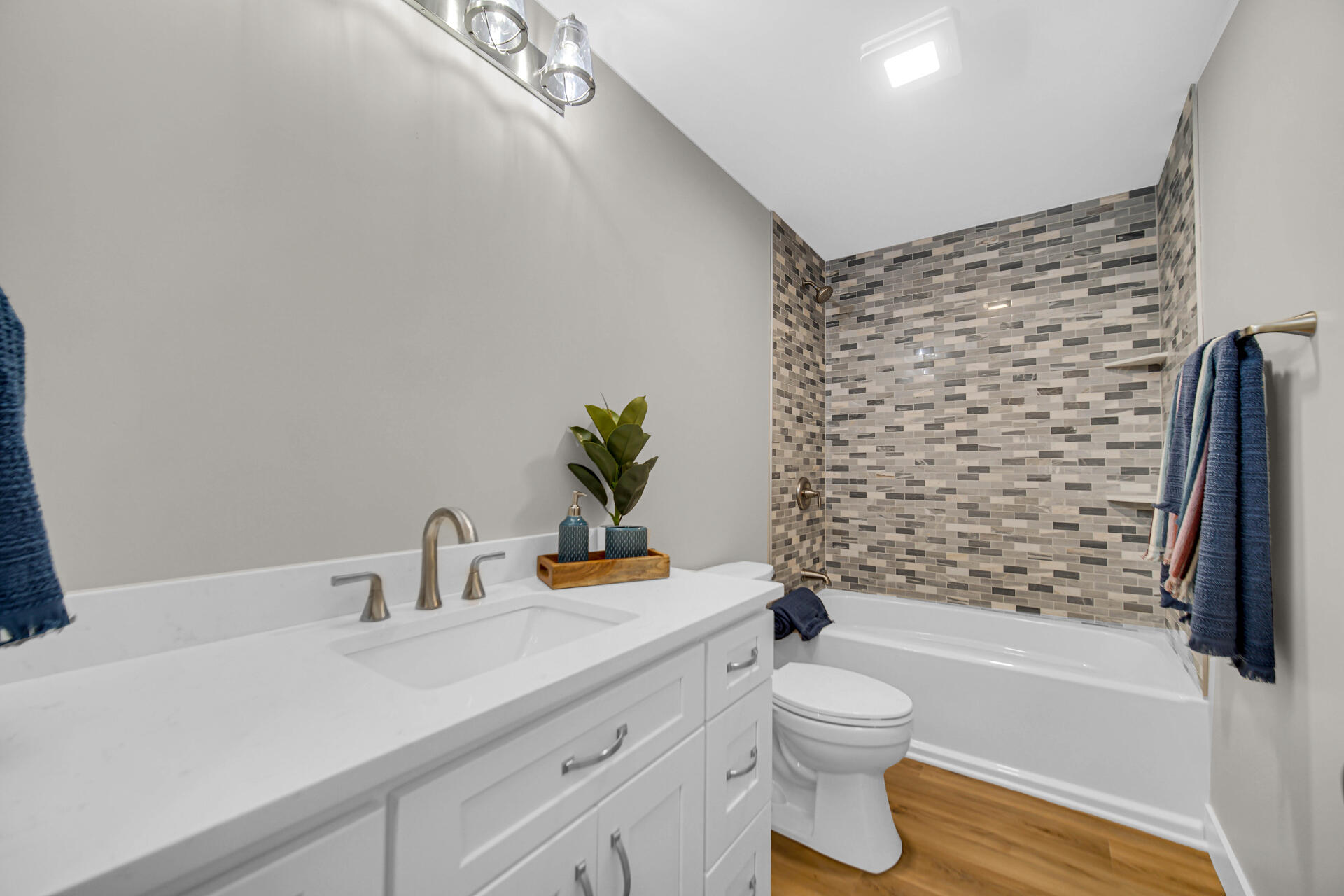 2792 Irving Street Portage, IN 46368 - Photo 11 of 16 a bathroom with a sink a toilet and shower