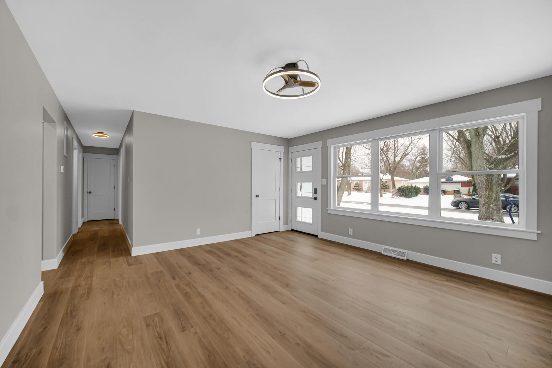 2792 Irving Street Portage, IN 46368 - Photo 3 of 16 an empty room with wooden floor and windows