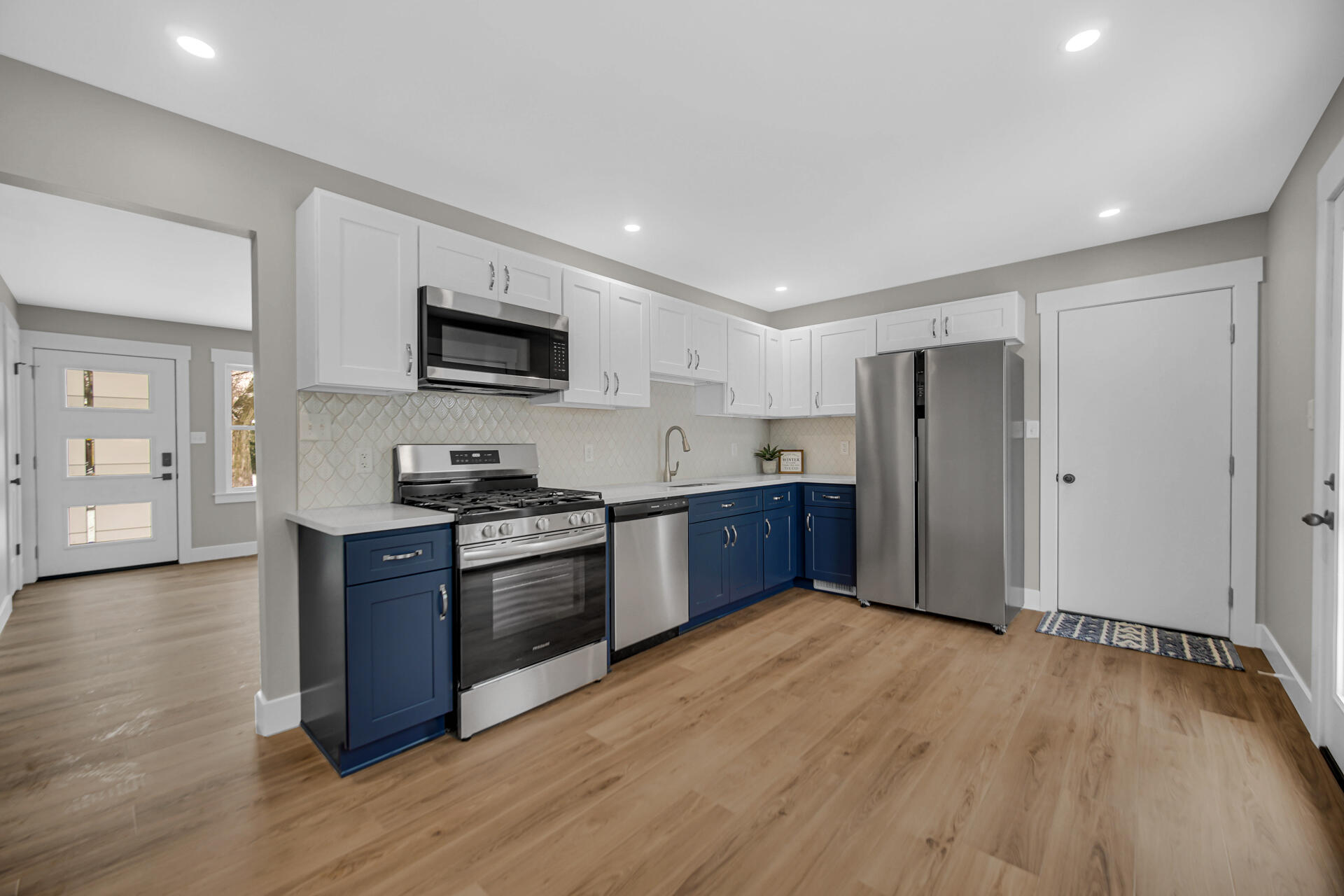 2792 Irving Street Portage, IN 46368 - Photo 7 of 16 a kitchen with stainless steel appliances granite countertop a refrigerator and a stove top oven