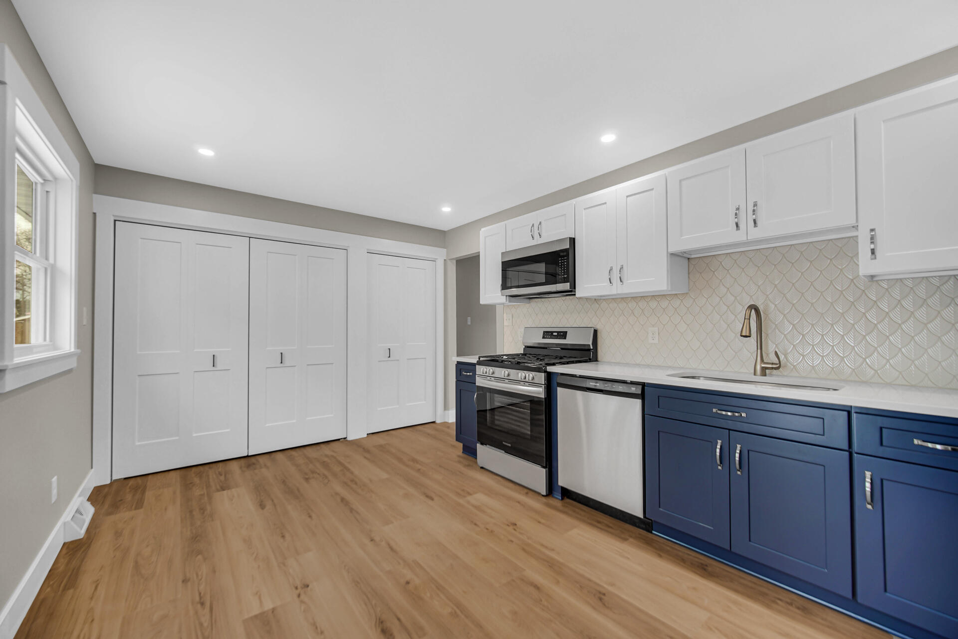 2792 Irving Street Portage, IN 46368 - Photo 8 of 16 a kitchen with sink a stove and cabinets