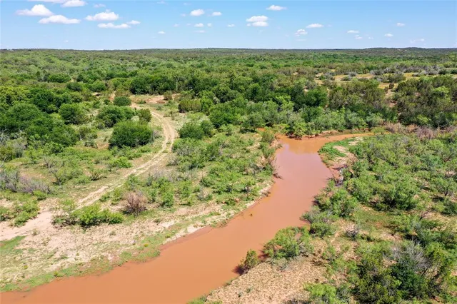 a view of lake with green space