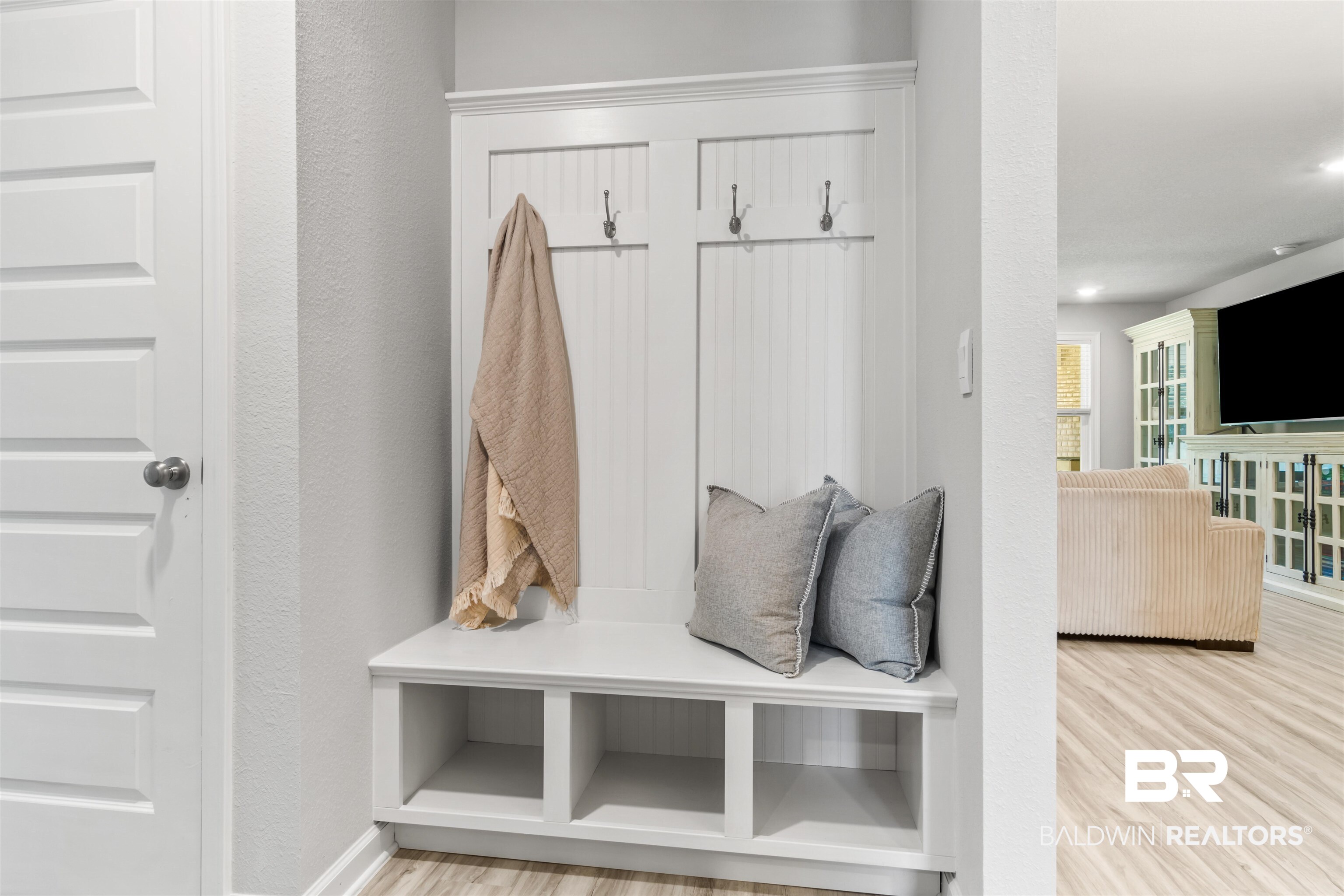 24472 Ringneck Loop Elberta, AL 36530 - Photo 28 of 46 Mudroom featuring light wood finished floors, baseboards, and a textured wall