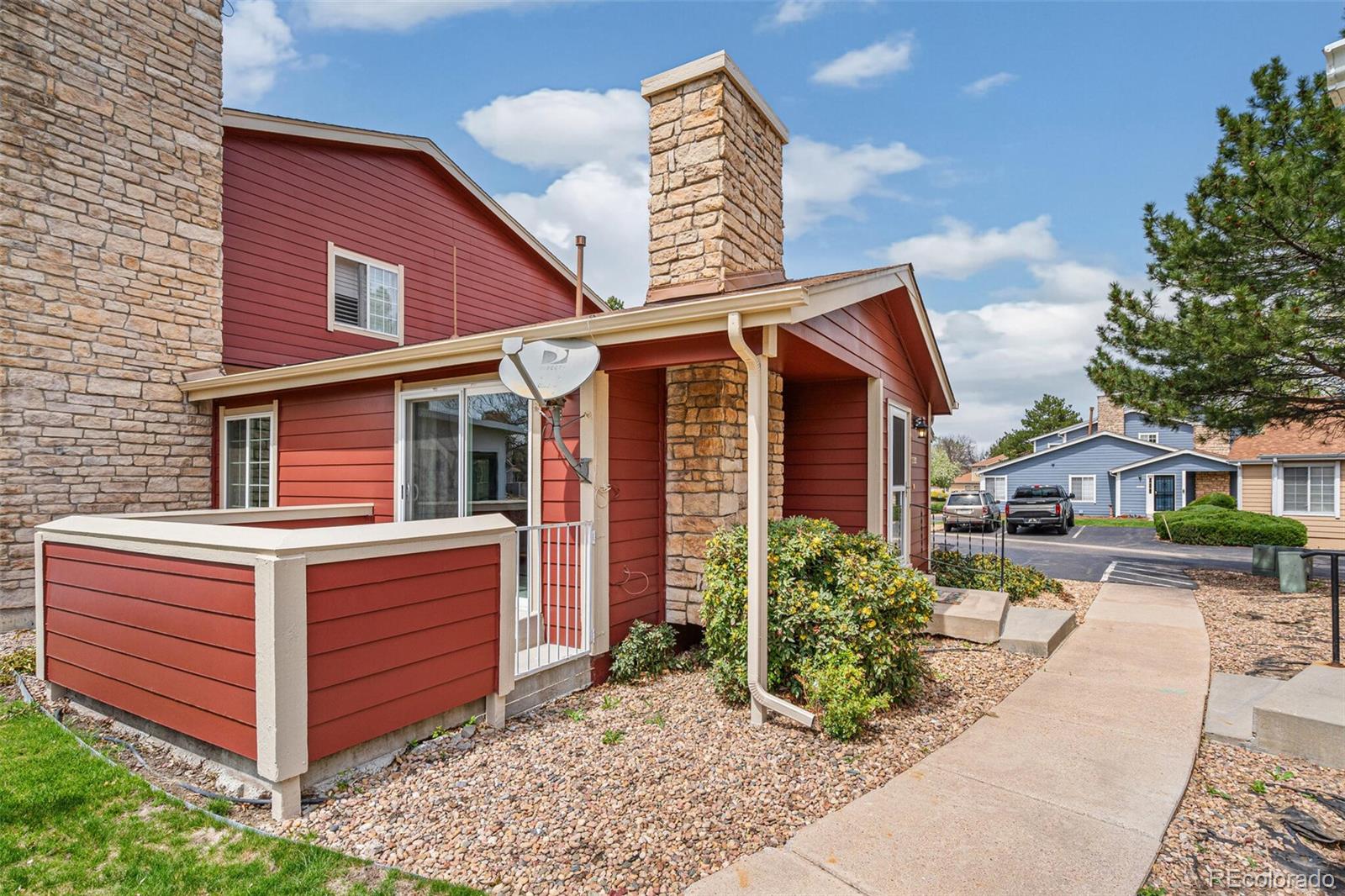 8424 Everett Way, Unit A Arvada, CO 80005 - Photo 24 of 25 a front view of a house with garden
