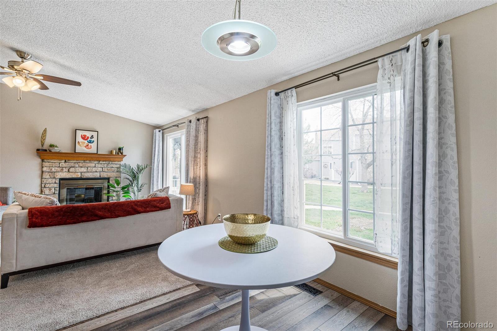 8424 Everett Way, Unit A Arvada, CO 80005 - Photo 8 of 25 a living room with furniture and a window