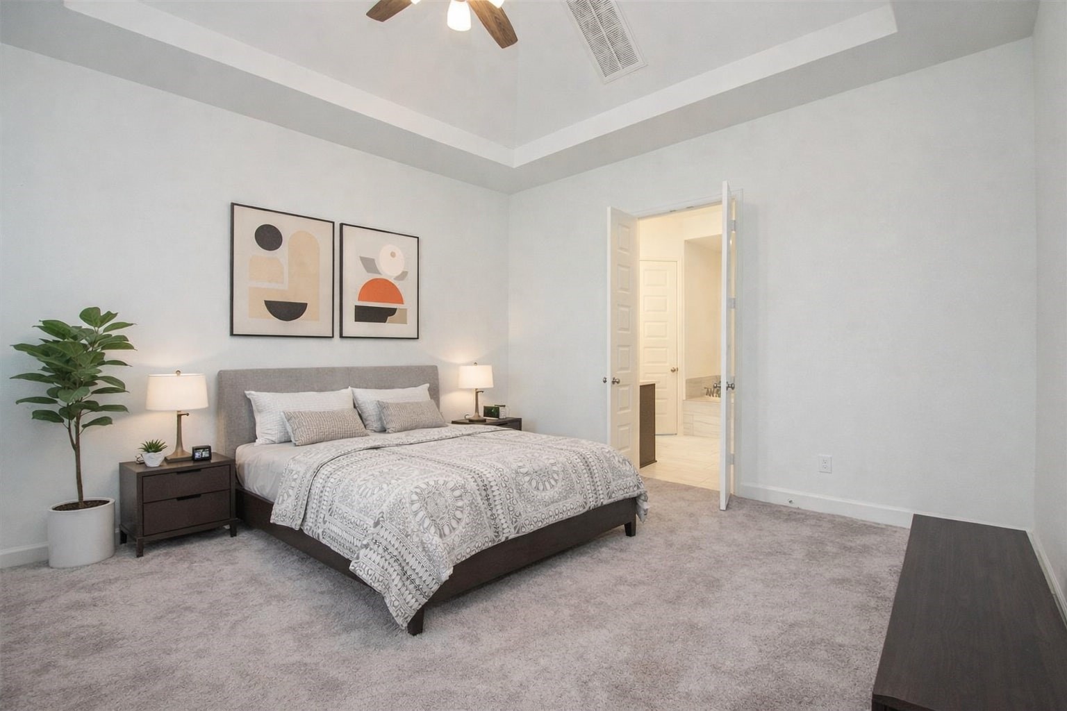 3011 Harbor Spring Way Manvel, TX 77578 - Photo 15 of 29 a spacious bedroom with a bed and a potted plant