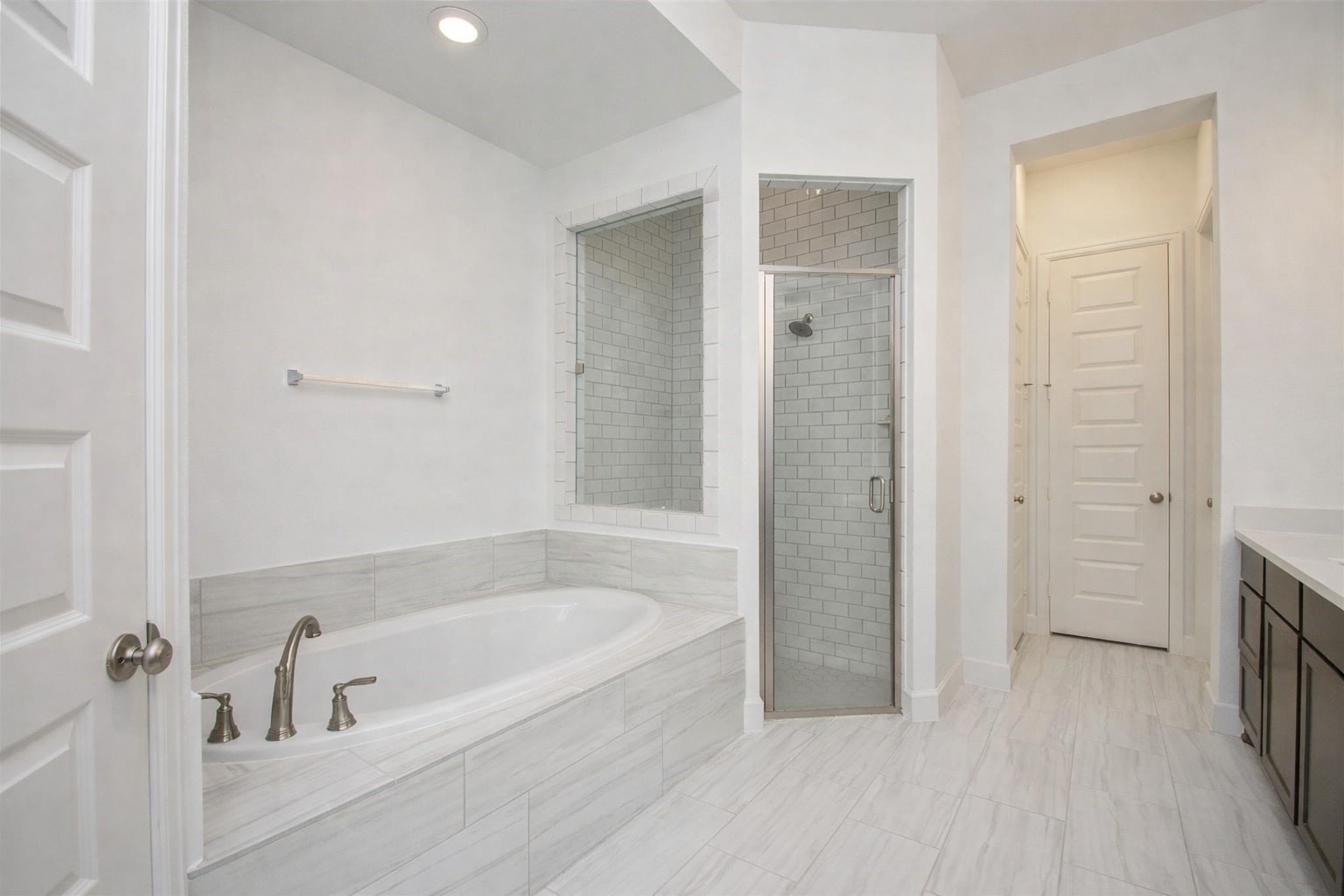 3011 Harbor Spring Way Manvel, TX 77578 - Photo 18 of 29 a bathroom with a bathtub and a shower