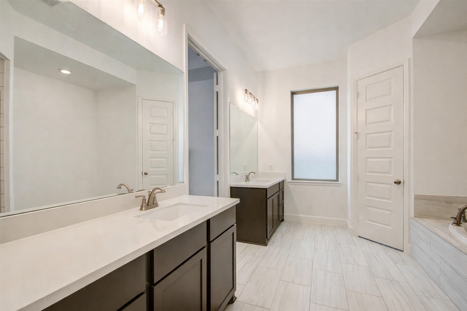 3011 Harbor Spring Way Manvel, TX 77578 - Photo 19 of 29 a bathroom with a sink and a mirror