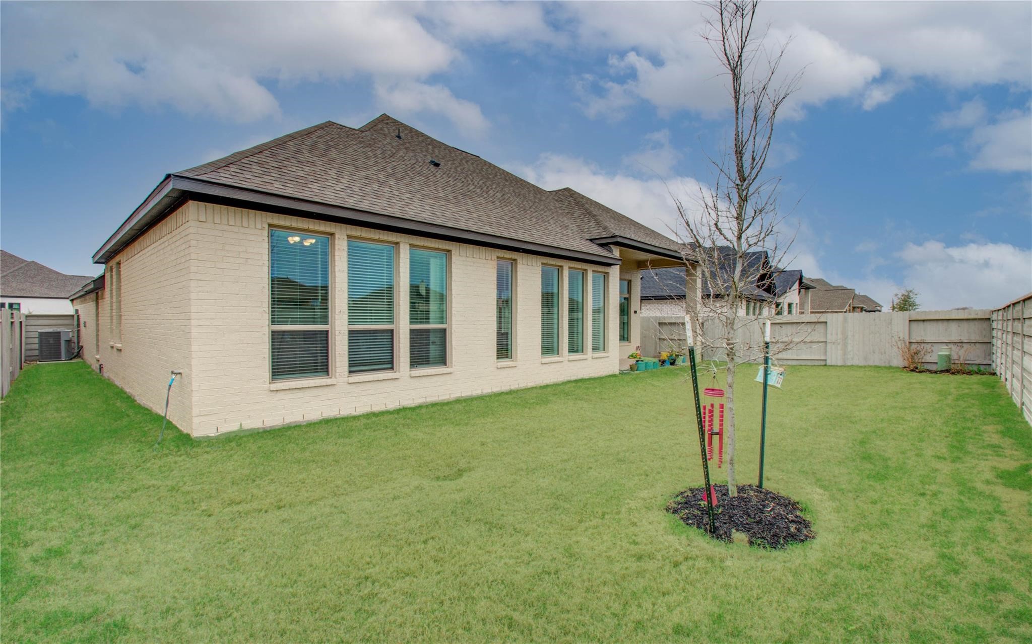 3011 Harbor Spring Way Manvel, TX 77578 - Photo 29 of 29 a front view of a house with a garden