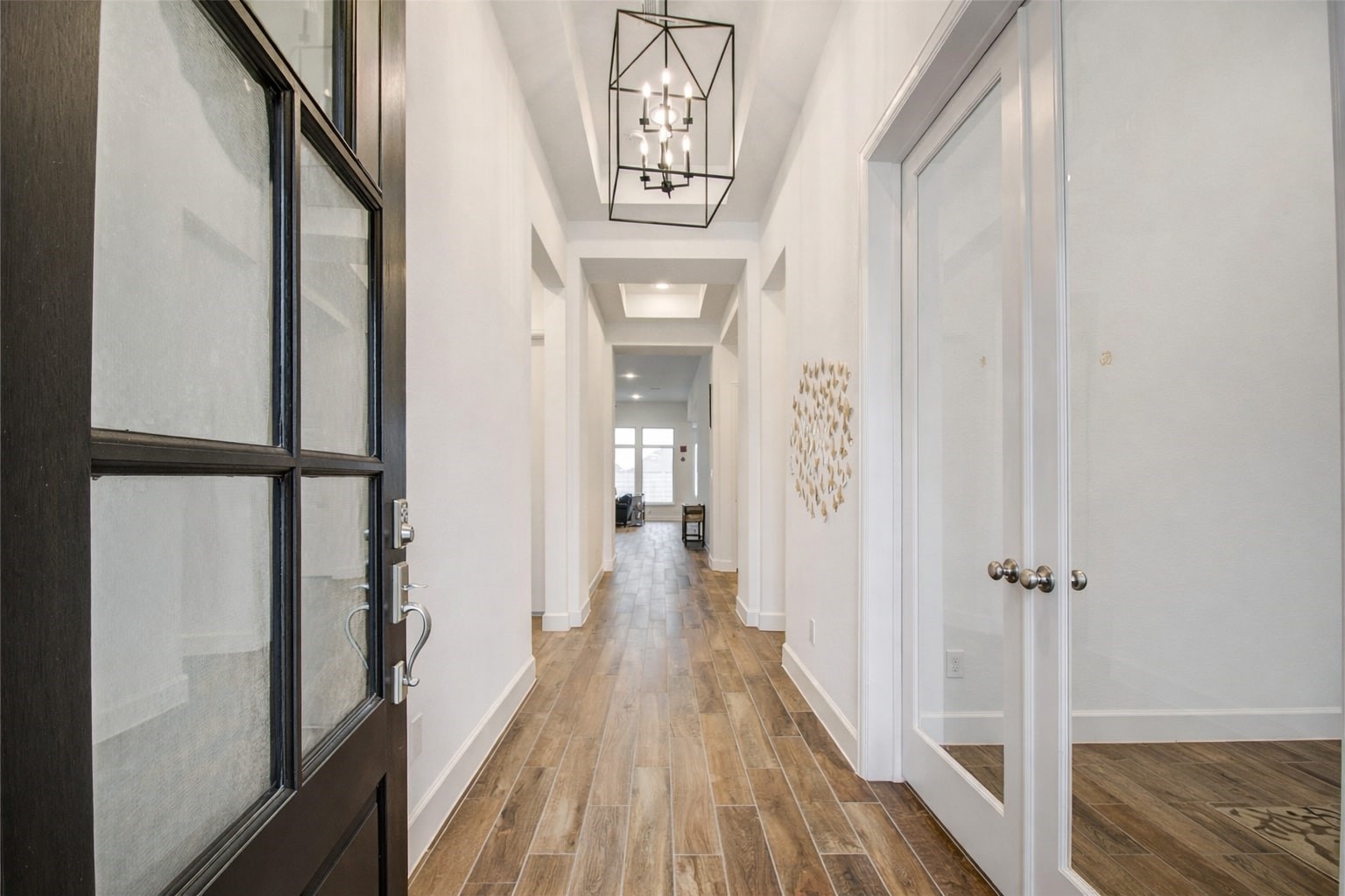 3011 Harbor Spring Way Manvel, TX 77578 - Photo 4 of 29 a view of a hallway with wooden floor and staircase