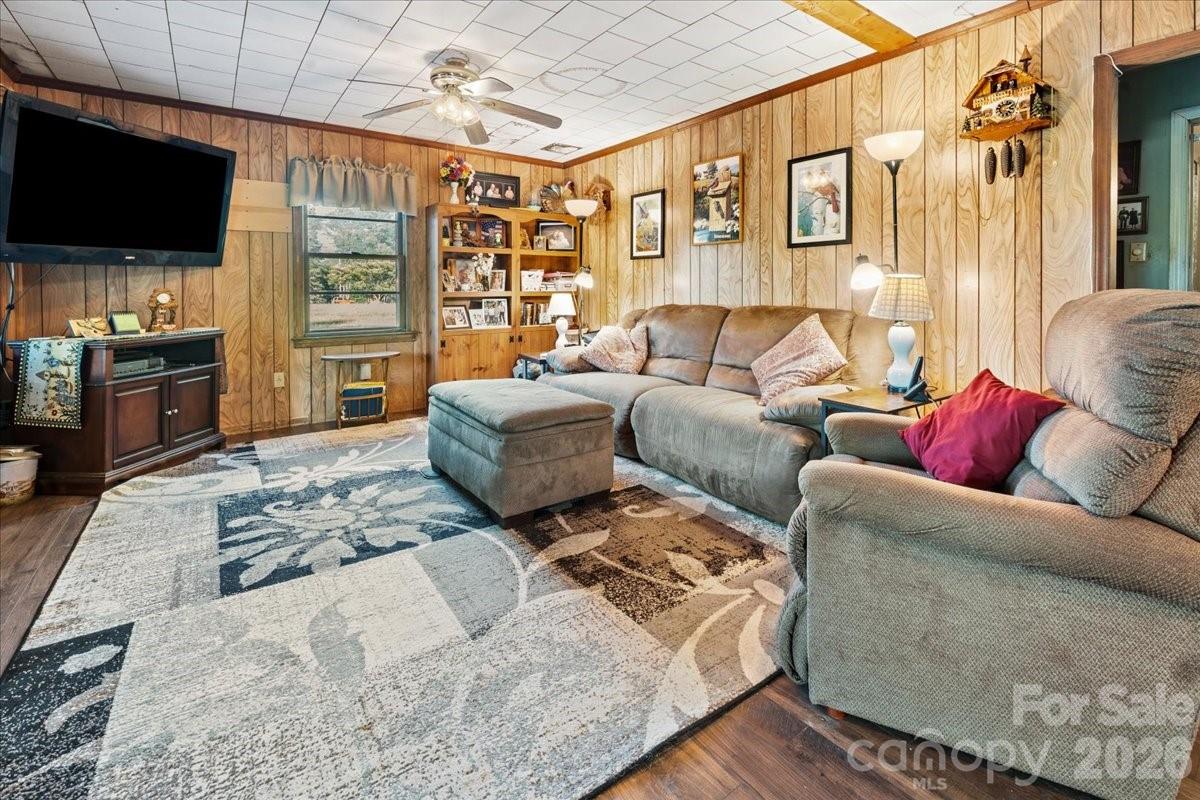 12282 Coyle Road Stanfield, NC 28163 - Photo 5 of 24 a living room with furniture and a flat screen tv