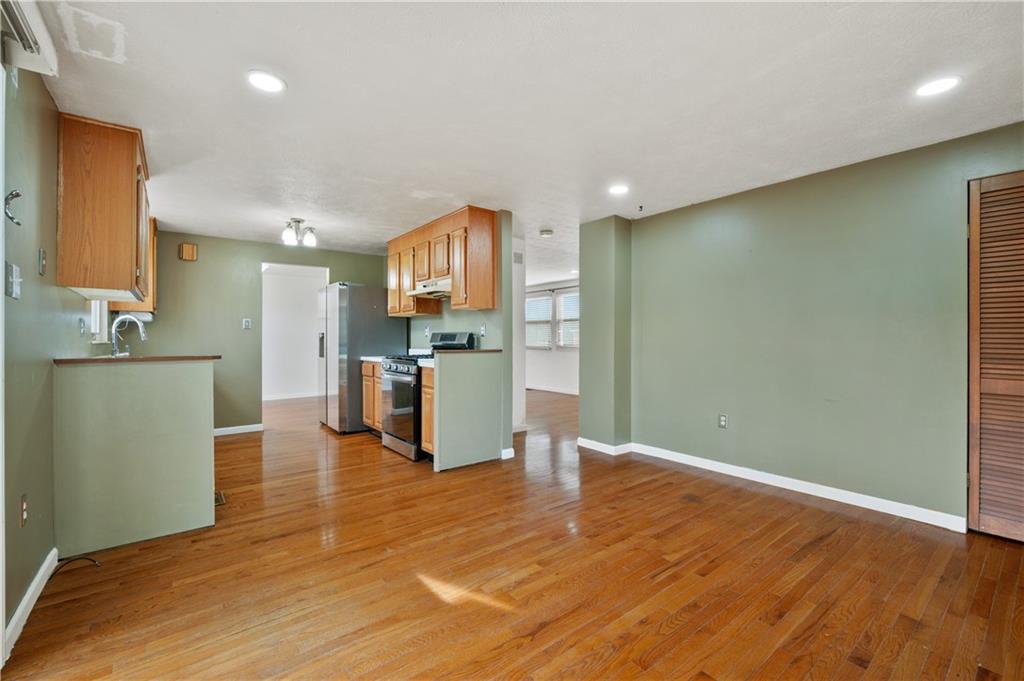 2203 Open Meadow Circle Bridgeville, PA 15017 - Photo 11 of 29 a view of kitchen with furniture and wooden floor