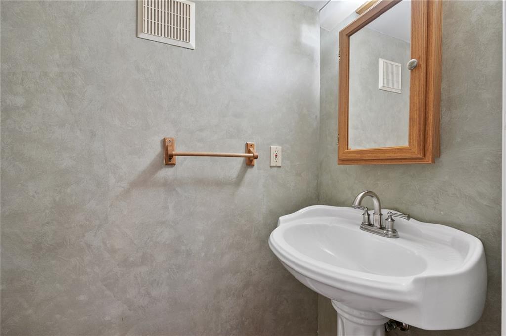 2203 Open Meadow Circle Bridgeville, PA 15017 - Photo 12 of 29 a white sink sitting next to a white sink