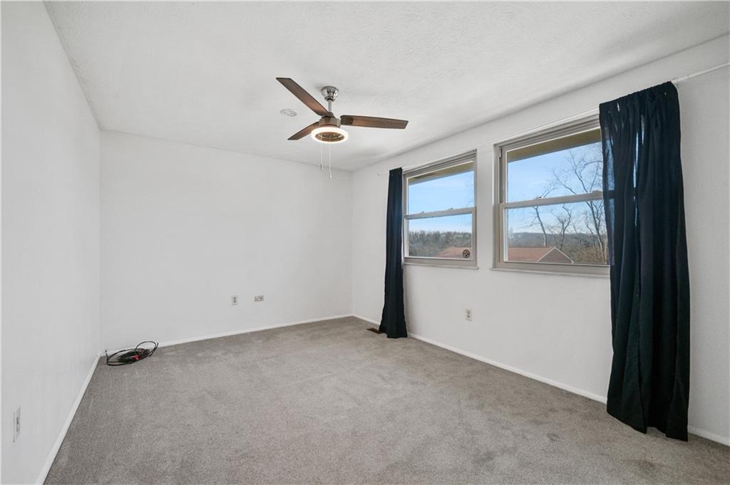 2203 Open Meadow Circle Bridgeville, PA 15017 - Photo 18 of 29 an empty room with windows