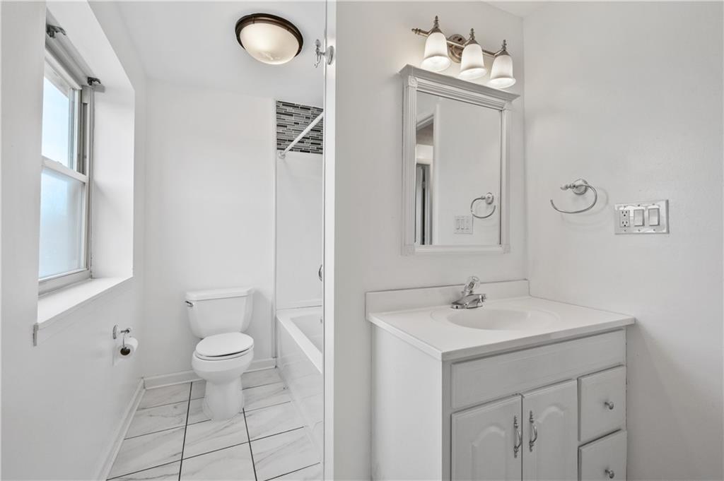 2203 Open Meadow Circle Bridgeville, PA 15017 - Photo 19 of 29 a bathroom with a sink toilet and a mirror