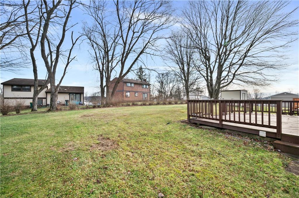 2203 Open Meadow Circle Bridgeville, PA 15017 - Photo 24 of 29 a view of a house with a yard covered with snow and trees