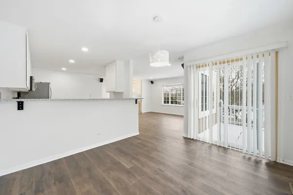 a view of a kitchen with a sink and a window