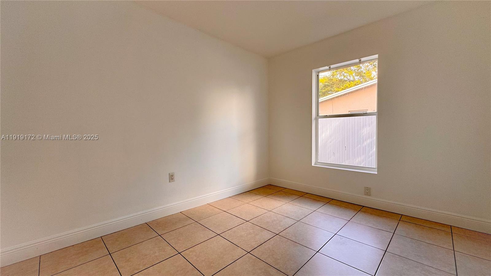 1835 Northwest 94th Street Miami, FL 33147 - Photo 13 of 22 a view of an empty room and window