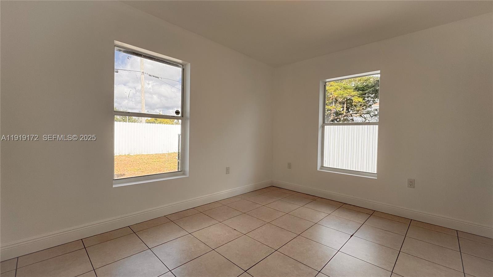 1835 Northwest 94th Street Miami, FL 33147 - Photo 17 of 22 an empty room with windows