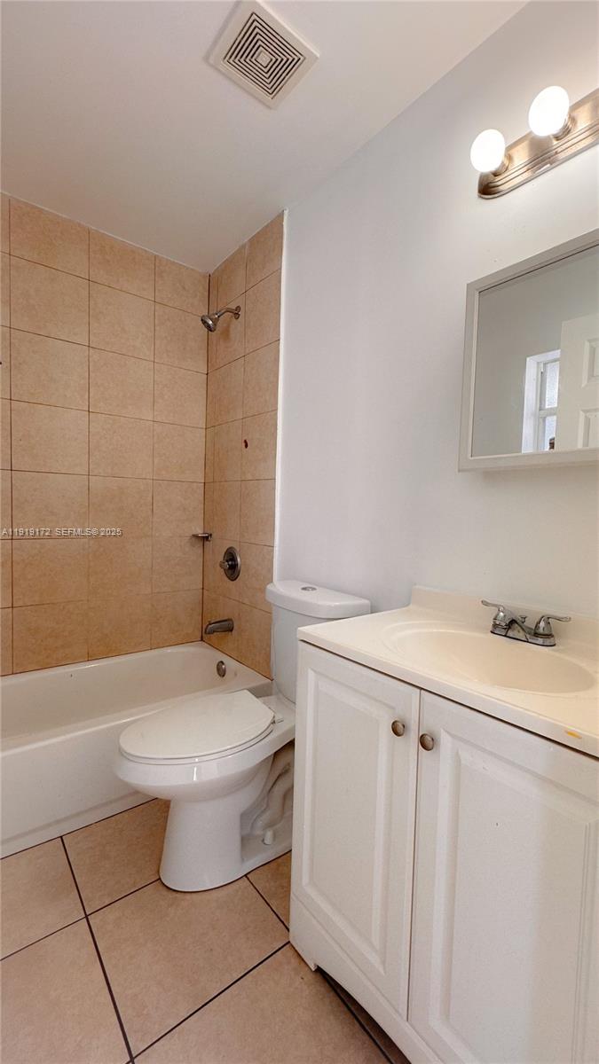 1835 Northwest 94th Street Miami, FL 33147 - Photo 20 of 22 a bathroom with a sink a toilet and shower