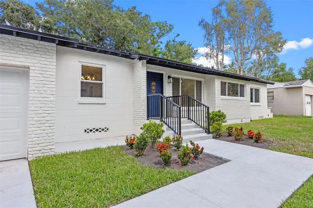 a front view of a house with garden