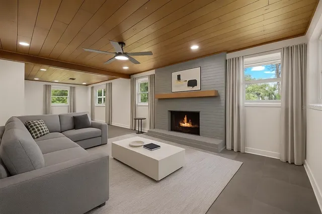 a living room with furniture and a fireplace
