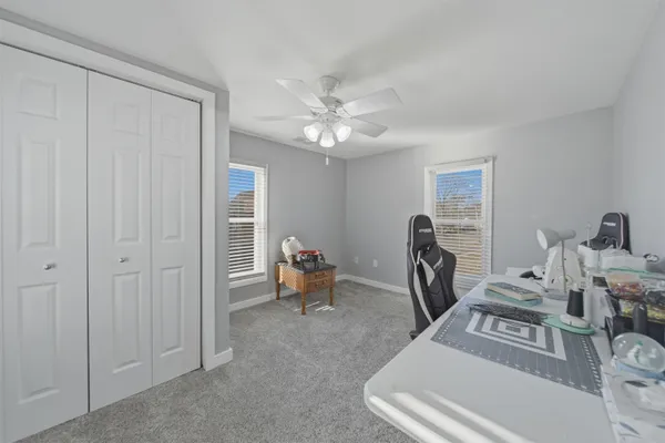 a view of a livingroom with a workspace