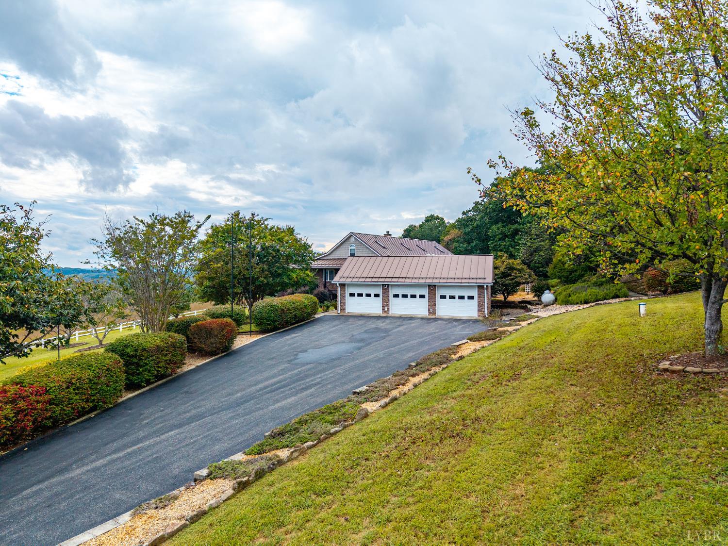 1704 Dearing Ford Road Altavista, VA 24517 - Photo 12 of 82 a front view of a house with a yard and large trees