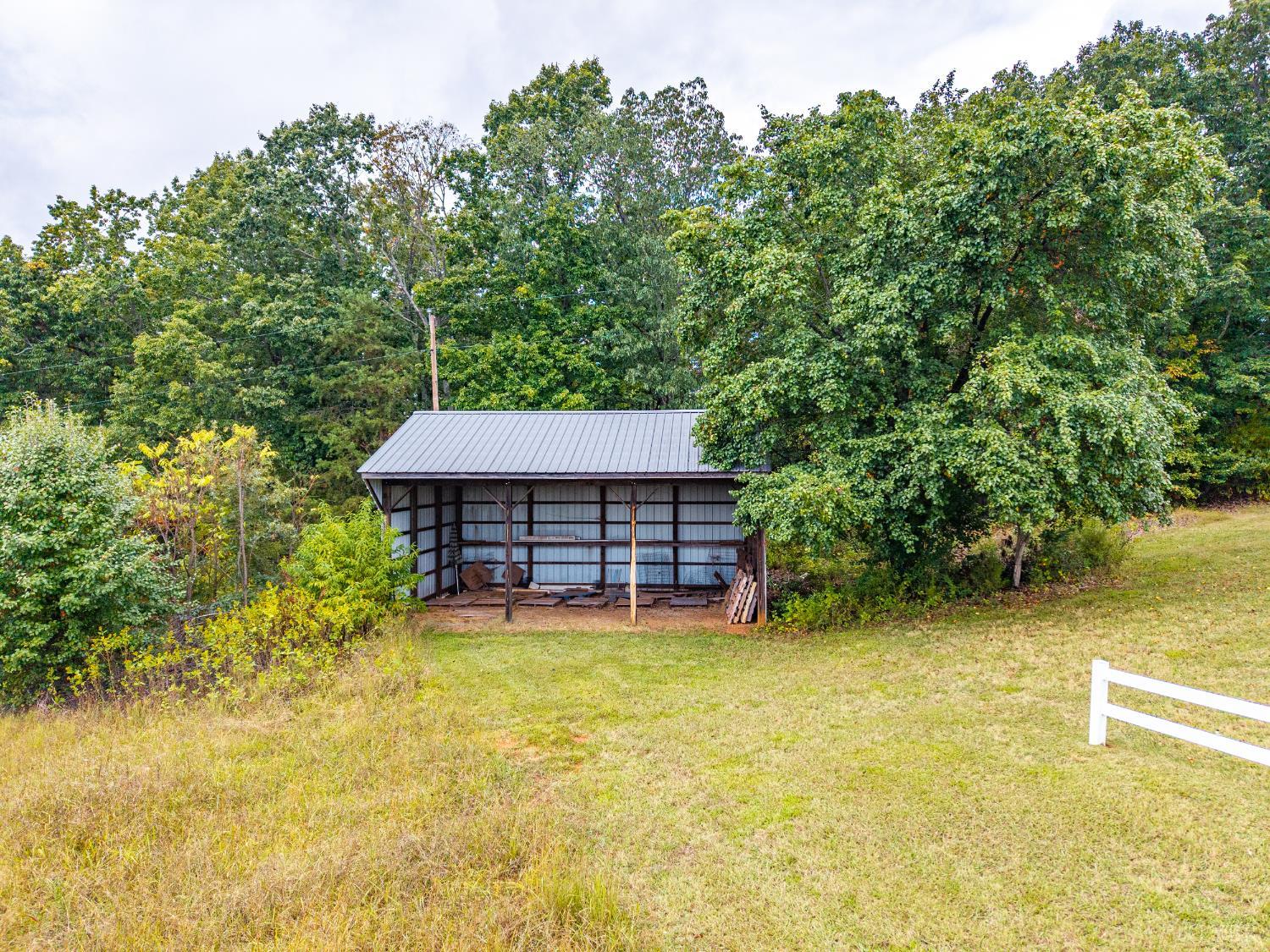 1704 Dearing Ford Road Altavista, VA 24517 - Photo 13 of 82 a view of a house with a yard and a tree