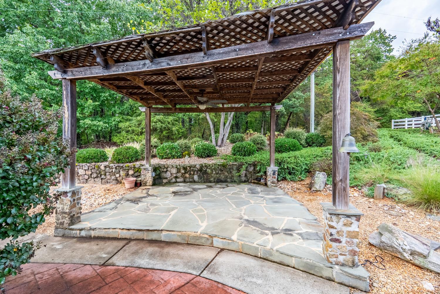 1704 Dearing Ford Road Altavista, VA 24517 - Photo 7 of 82 a view of patio with a table and chairs under an umbrella