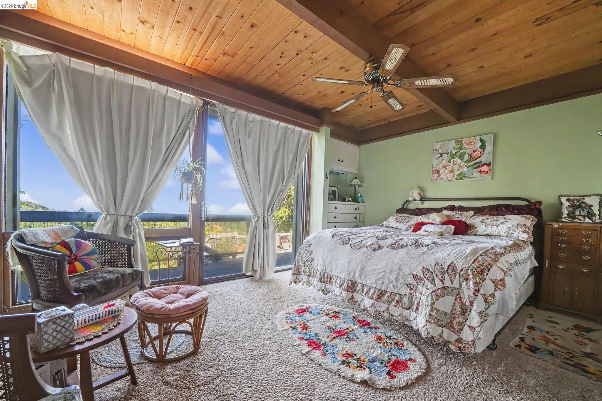 6161 Fullen Road Murphys, CA 95247 - Photo 39 of 53 a bedroom with a bed and a chandelier
