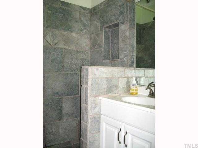 841 Cranbrook Road Raleigh, NC 27609 - Photo 6 of 10 Private master bath with tile shower & floor
