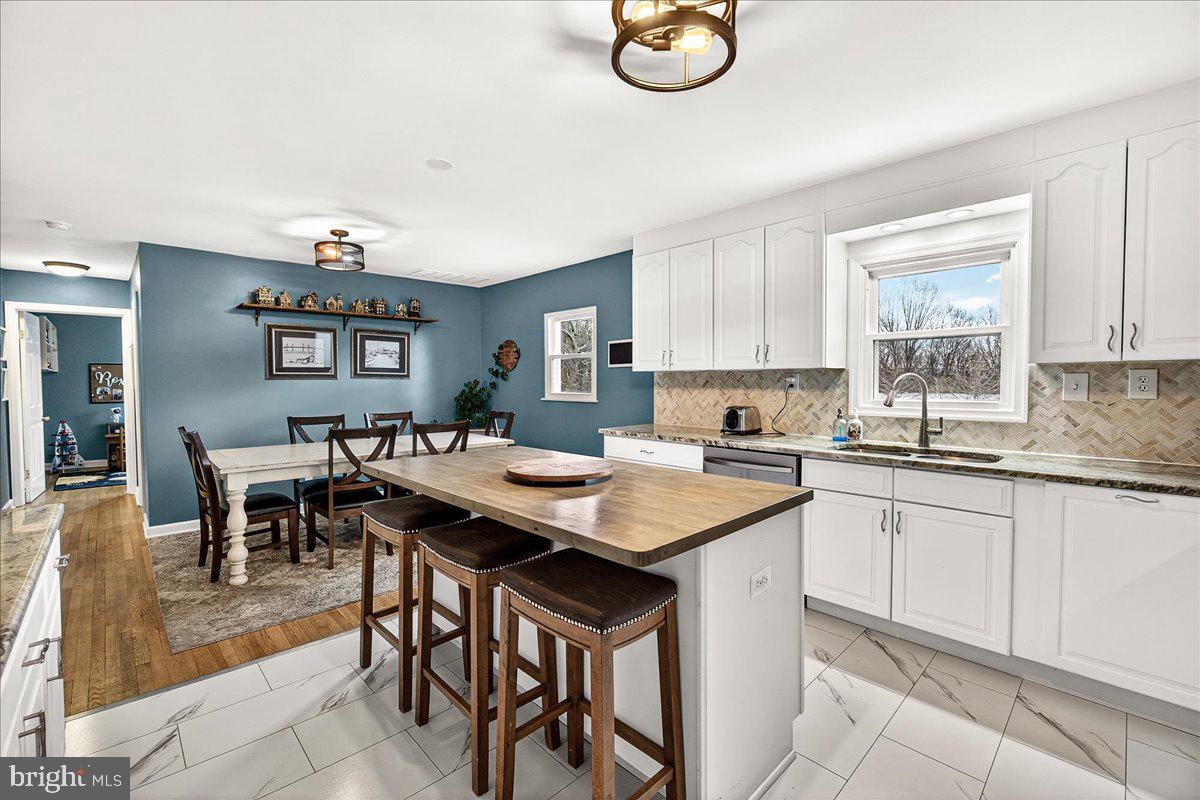 7201 Mountain Church Road Middletown, MD 21769 - Photo 16 of 37 a kitchen with a table and chairs in it