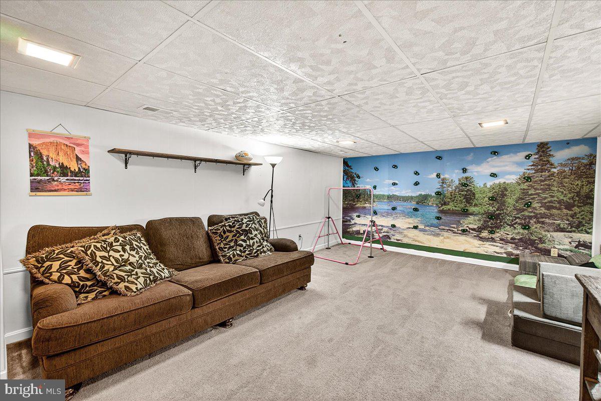 7201 Mountain Church Road Middletown, MD 21769 - Photo 17 of 37 a living room with furniture and a couch