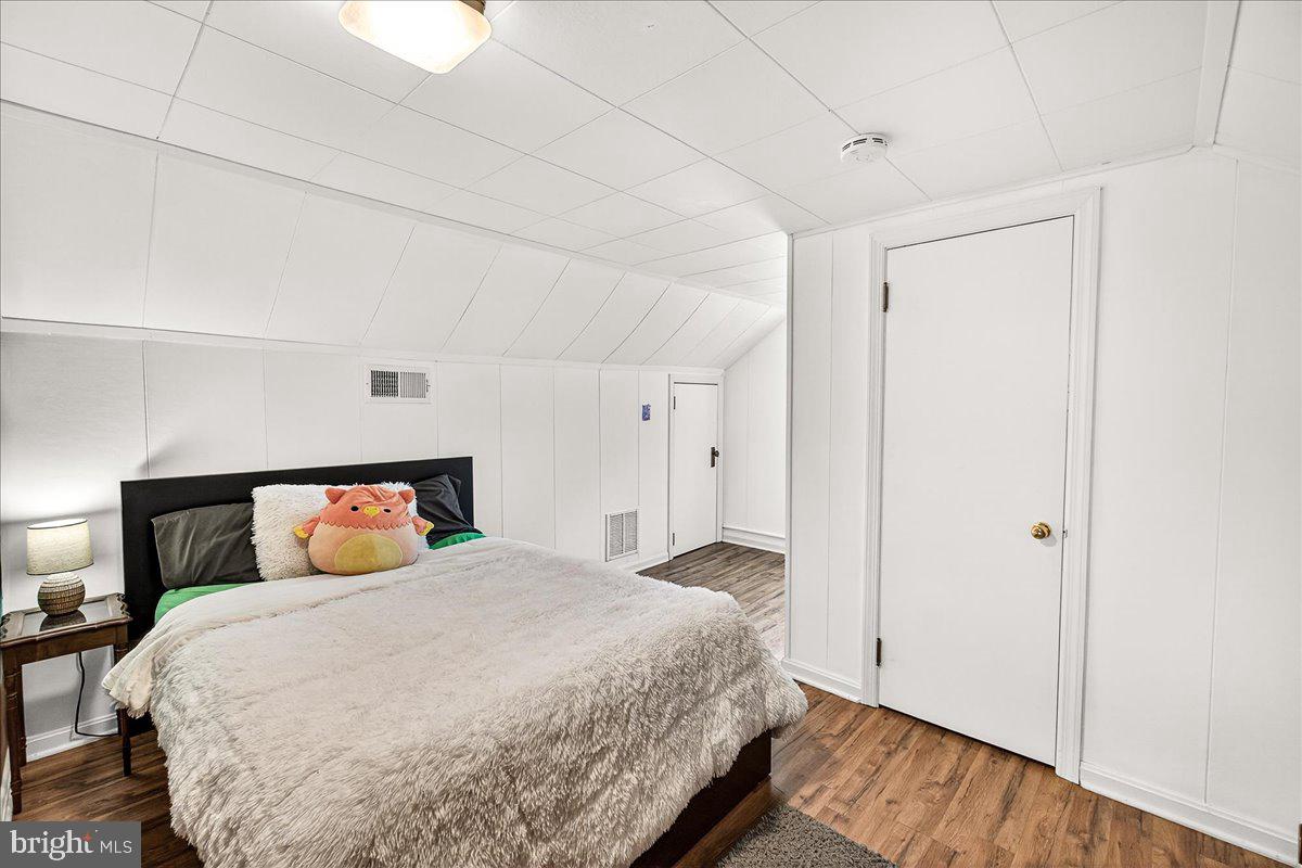 7201 Mountain Church Road Middletown, MD 21769 - Photo 26 of 37 a bedroom with a bed and wooden floor