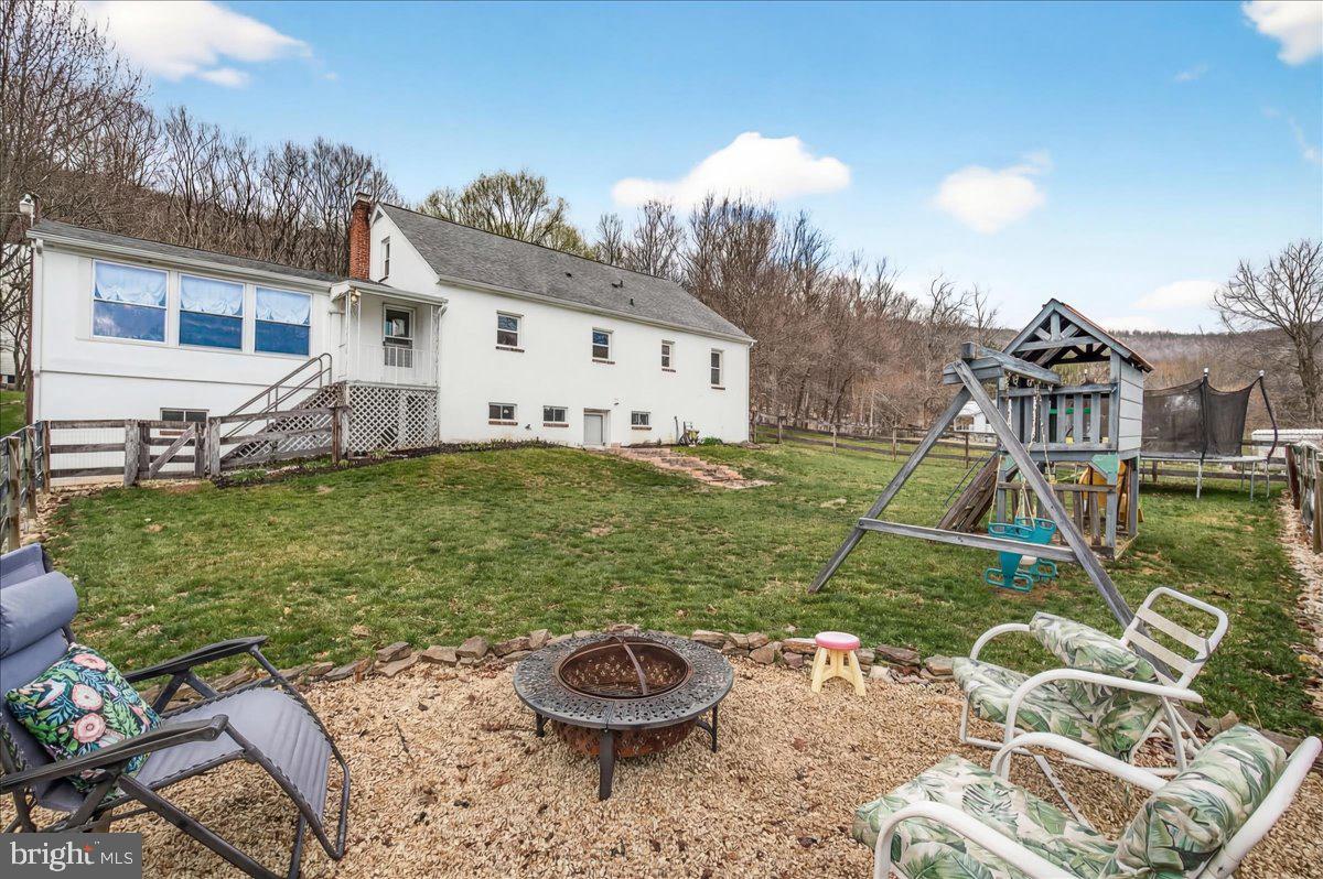7201 Mountain Church Road Middletown, MD 21769 - Photo 35 of 37 a view of a backyard with table and chairs and potted plants