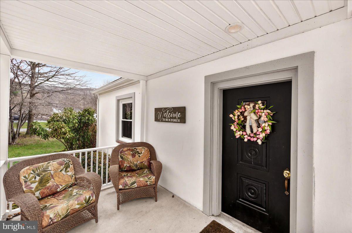 7201 Mountain Church Road Middletown, MD 21769 - Photo 5 of 37 a balcony with furniture and a window