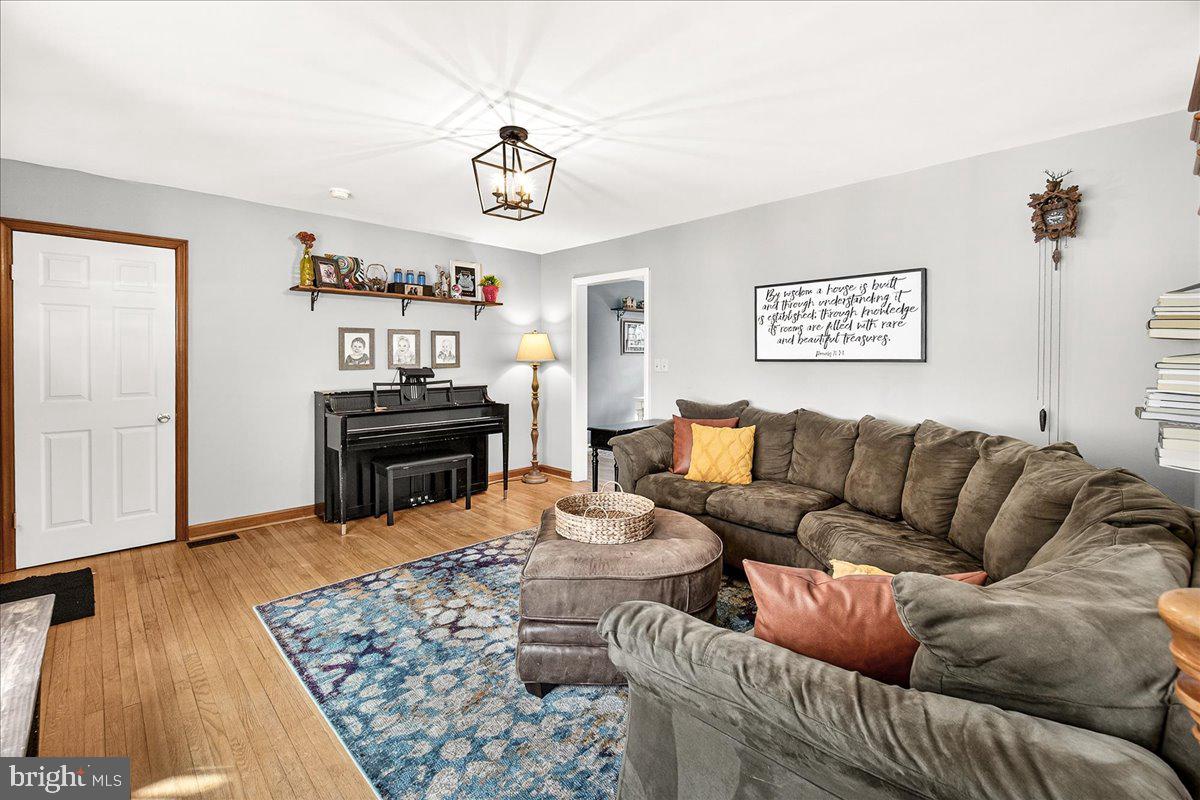 7201 Mountain Church Road Middletown, MD 21769 - Photo 8 of 37 a living room with furniture and a wooden floor