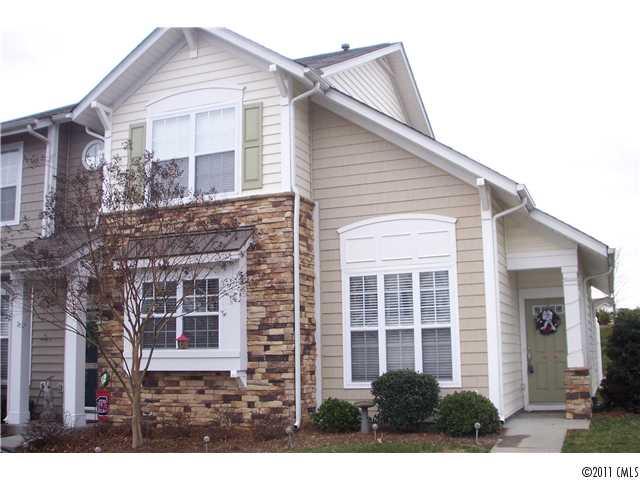 958 Copperstone Lane, Unit 162 Fort Mill, SC 29708 - Photo 1 of 14 a front view of a house with a yard