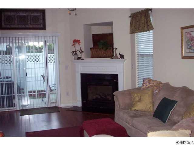 958 Copperstone Lane, Unit 162 Fort Mill, SC 29708 - Photo 2 of 14 a living room with furniture and a fireplace