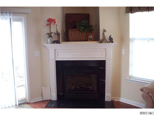958 Copperstone Lane, Unit 162 Fort Mill, SC 29708 - Photo 3 of 14 a living room with a fireplace furniture and a flat screen tv