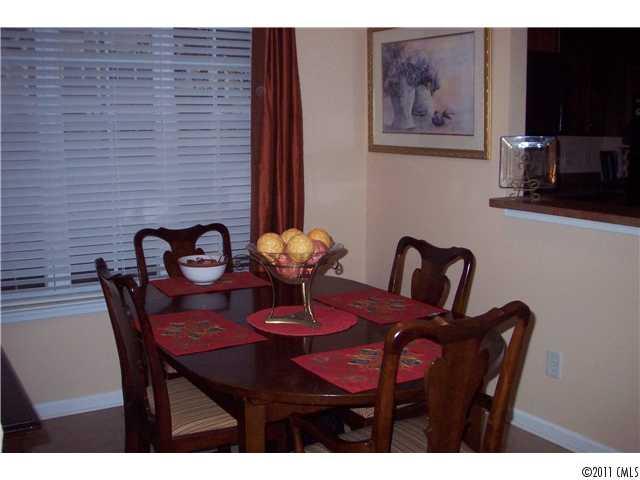 958 Copperstone Lane, Unit 162 Fort Mill, SC 29708 - Photo 4 of 14 a view of a dining room with furniture and wooden floor