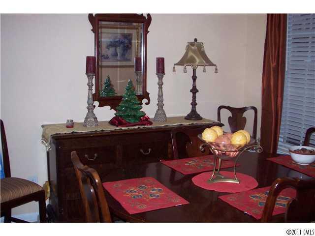 958 Copperstone Lane, Unit 162 Fort Mill, SC 29708 - Photo 5 of 14 a living room with furniture and chandelier