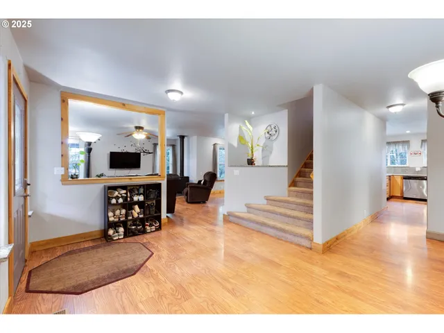 a view of a living room and bedroom with furniture