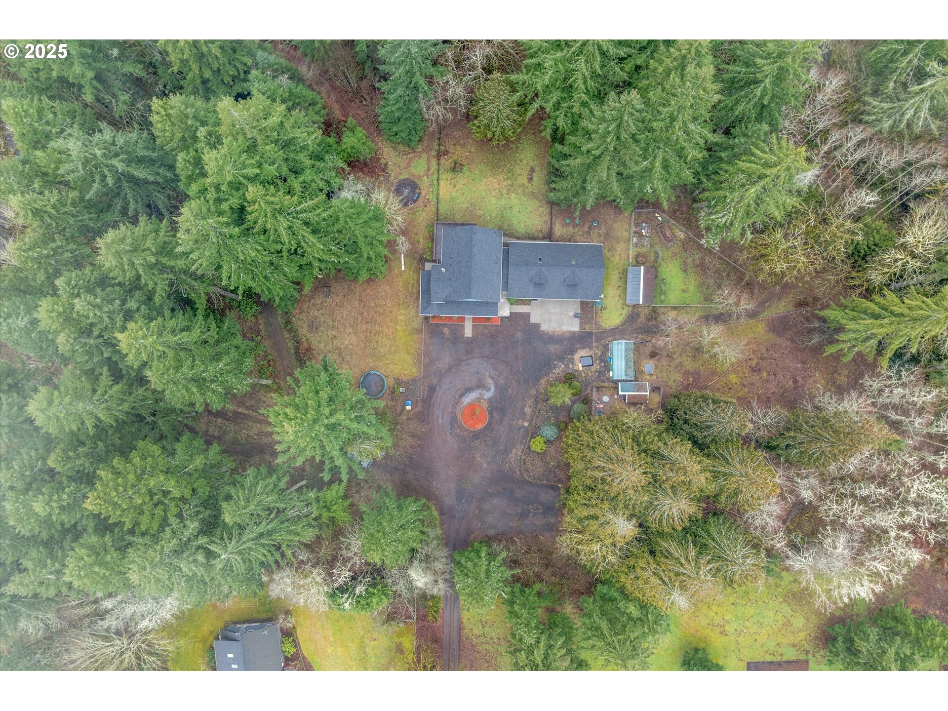 113 Garden Lane Winlock, WA 98596 - Photo 27 of 33 a aerial view of a house with a yard and trees all around