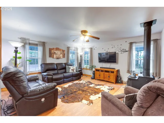 a living room with furniture fireplace and a flat screen tv