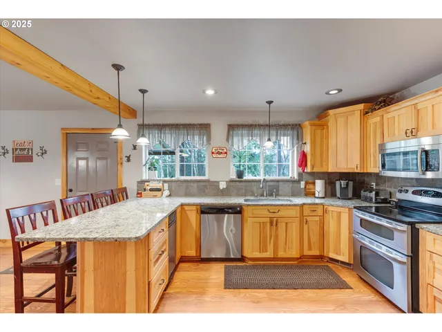 a large kitchen with granite countertop lots of counter top space