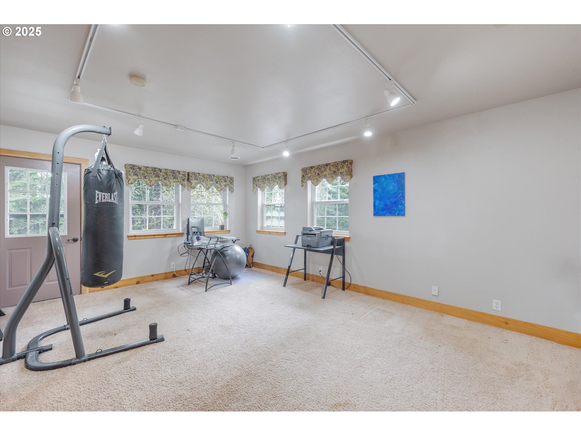 113 Garden Lane Winlock, WA 98596 - Photo 10 of 33 a living room with furniture a window and gym equipment