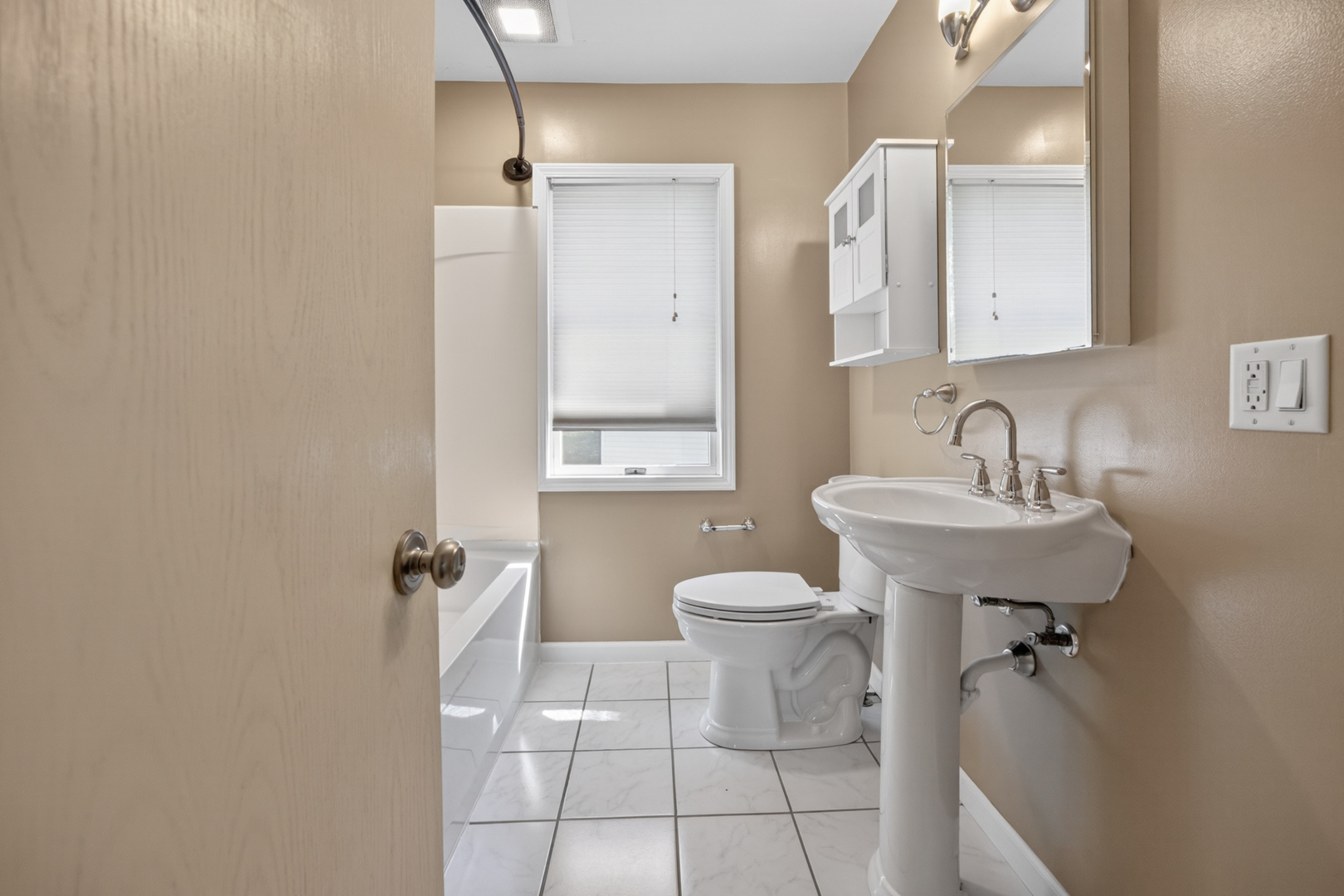 18 Mc Cormick Boulevard Normal, IL 61761 - Photo 12 of 25 a bathroom with a sink toilet and shower