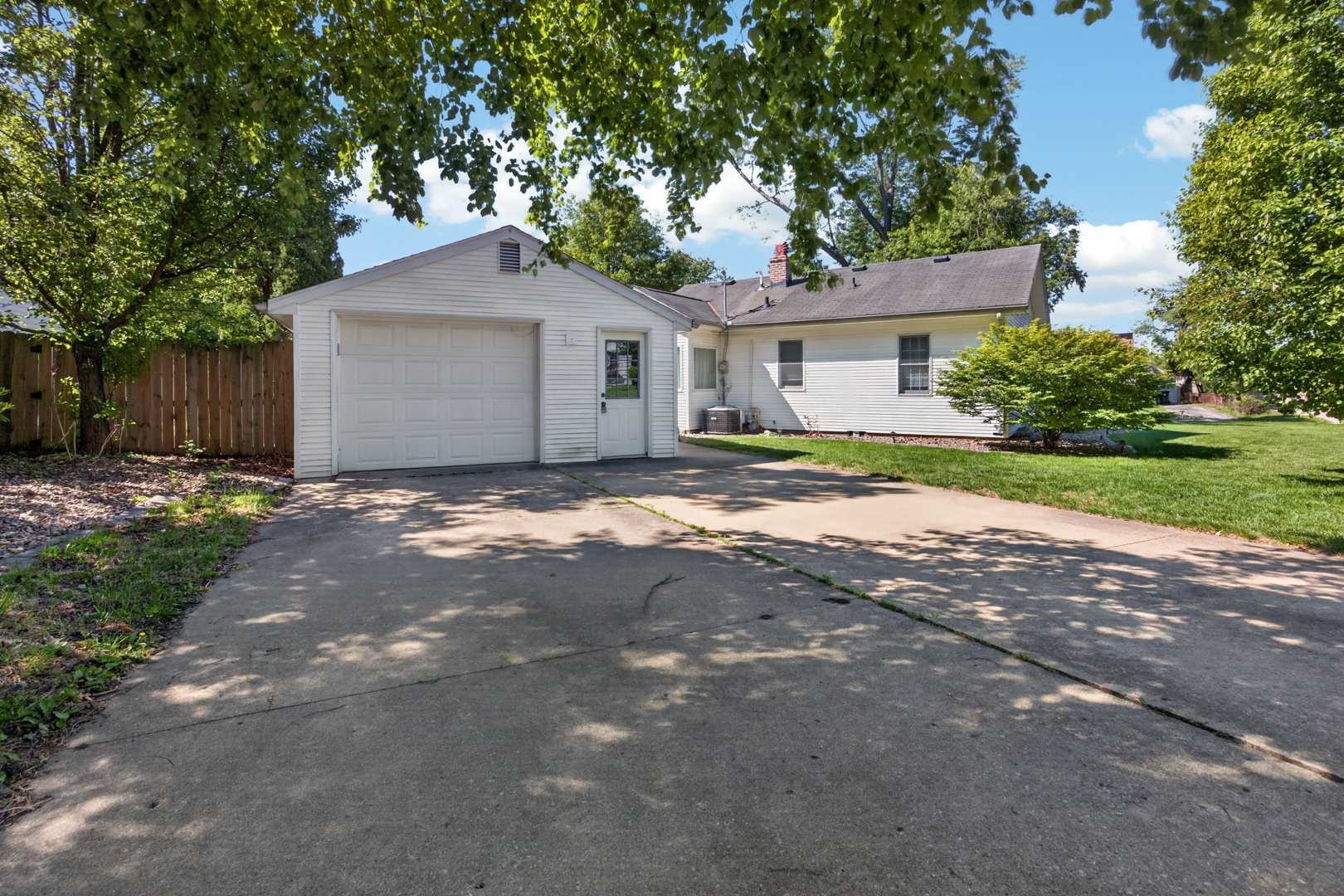 18 Mc Cormick Boulevard Normal, IL 61761 - Photo 21 of 25 a front view of a house with a yard and garage