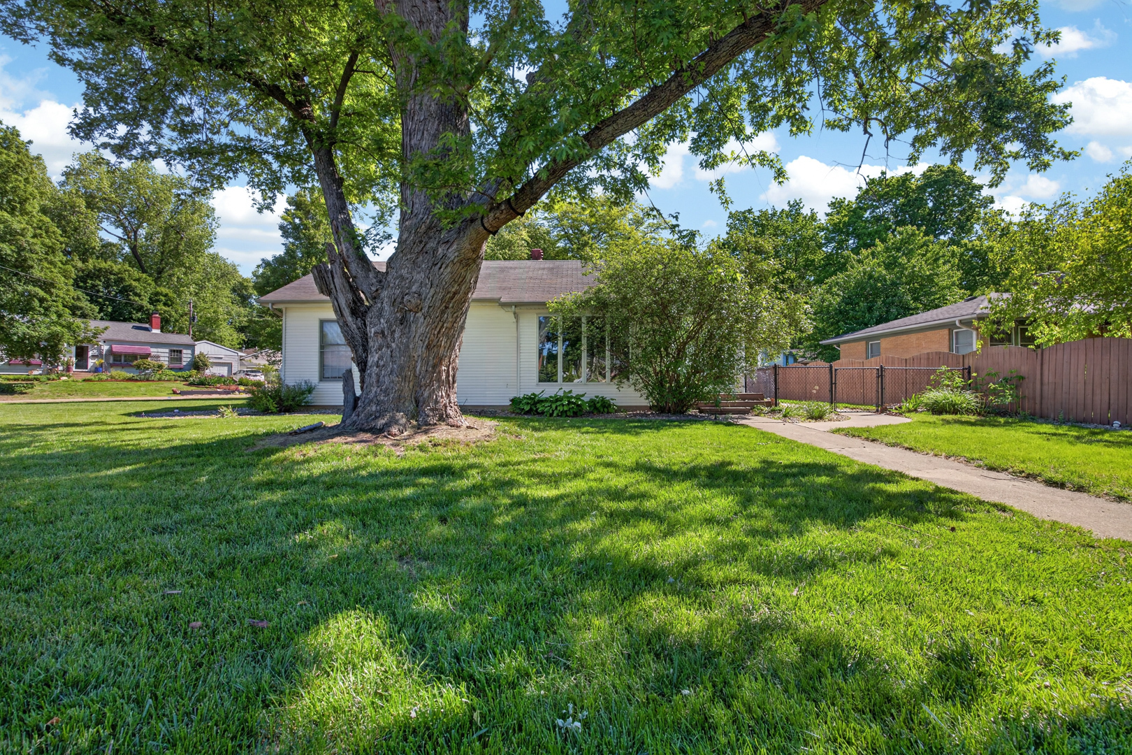 18 Mc Cormick Boulevard Normal, IL 61761 - Photo 22 of 25 a view of a house with backyard and a tree